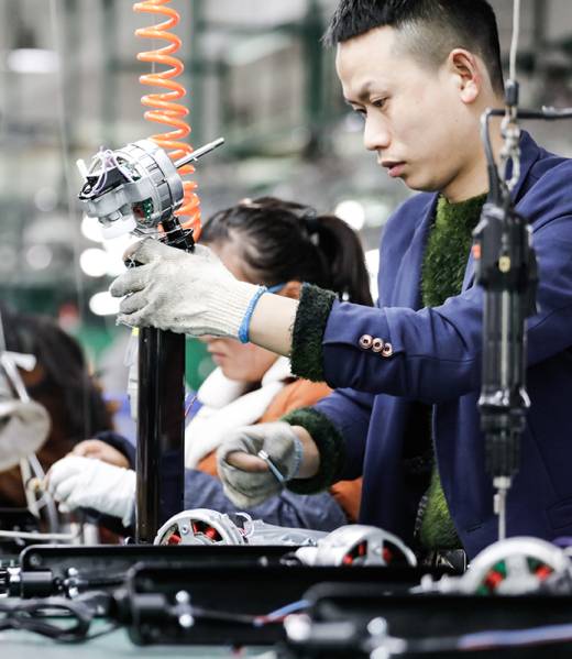 Jiujiang,China-march,17,,2018:,Workers,On,The,Production,Line,Of JIUJIANG CHINA-March 17, 2018: workers on the production line of electrical appliances company, Jiujiang, Eastern China. Workers can't relax for a minute, like robots in Chaplin's movie modern times.